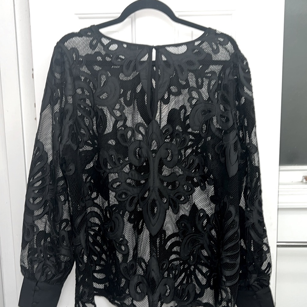 A black flowery mesh top